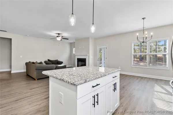 a view of living room kitchen and center island