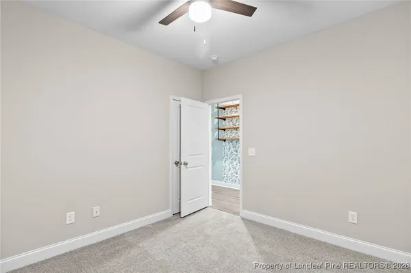 an empty room with shelves