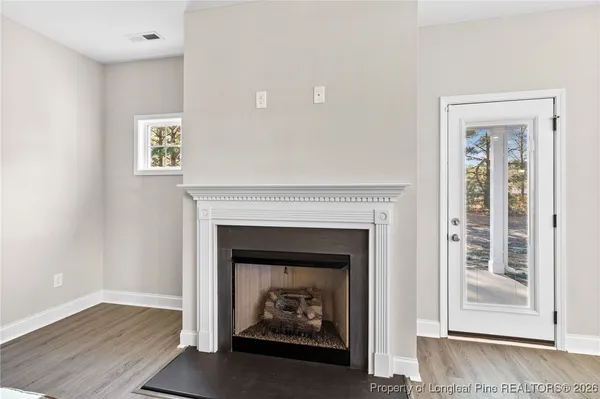 a living room with a fireplace