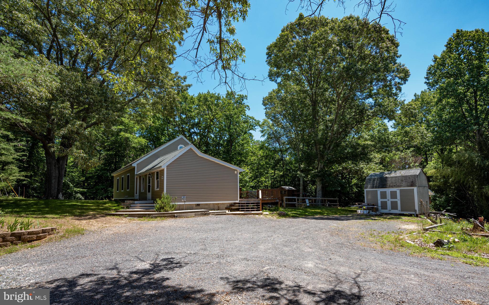 3930 Sixes Road Prince Frederick, MD 20678 - Photo 51 of 61 a view of a house with backyard and trees