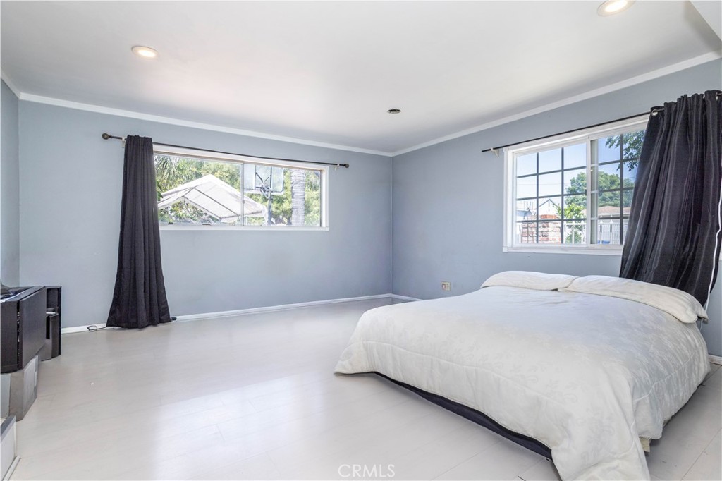 13655 Chase Street Arleta, CA 91331 - Photo 14 of 34 a bedroom with a bed and a window