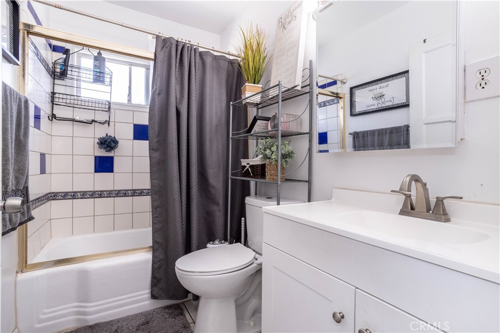 13655 Chase Street Arleta, CA 91331 - Photo 16 of 34 a bathroom with a sink a toilet and shower