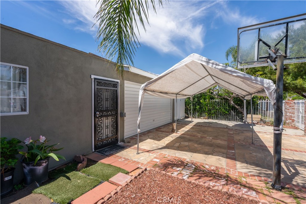 13655 Chase Street Arleta, CA 91331 - Photo 27 of 34 a front view of a house with a yard