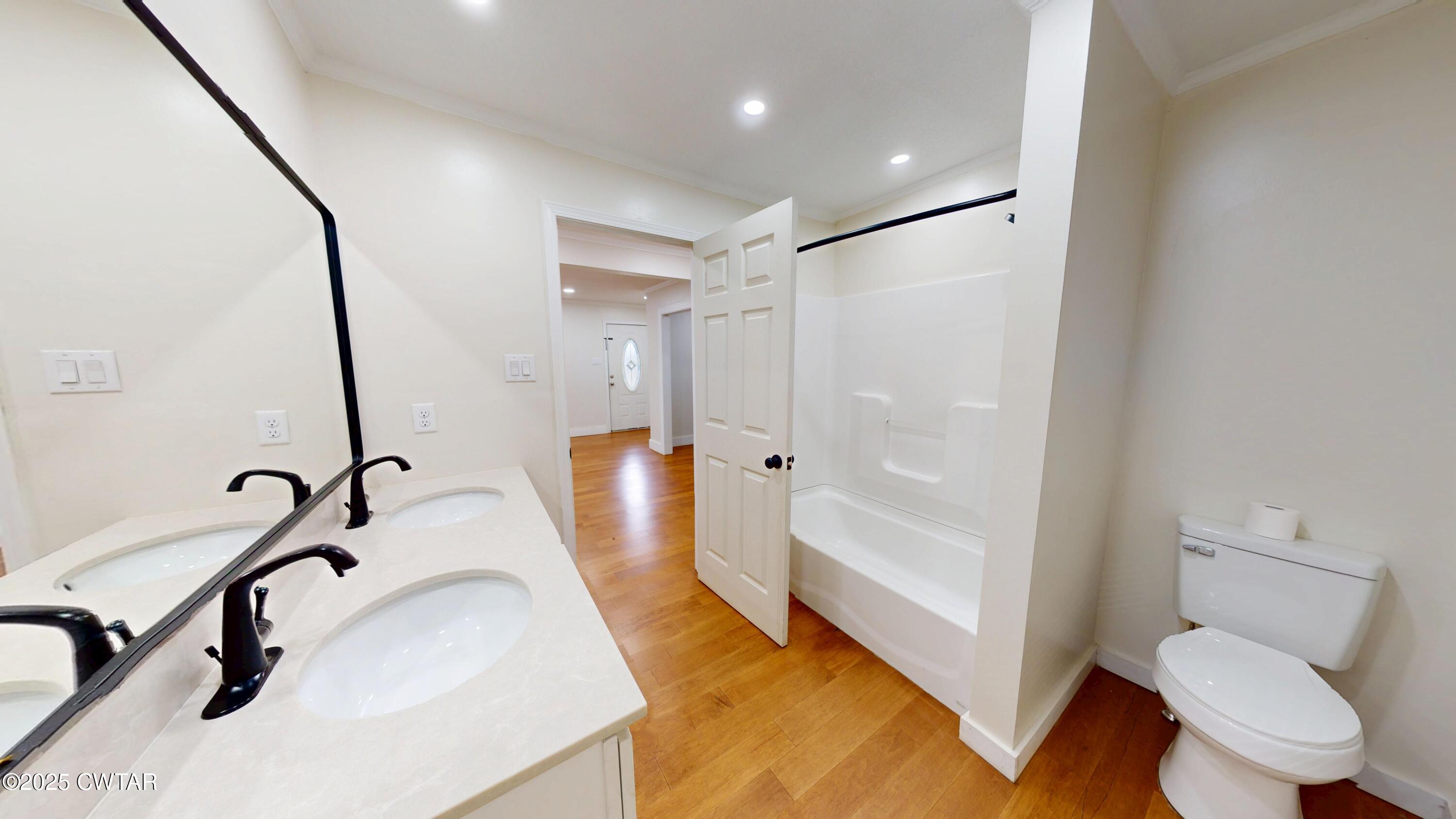 712 West Main Street Newbern, TN 38059 - Photo 16 of 27 a bathroom with a sink toilet and shower