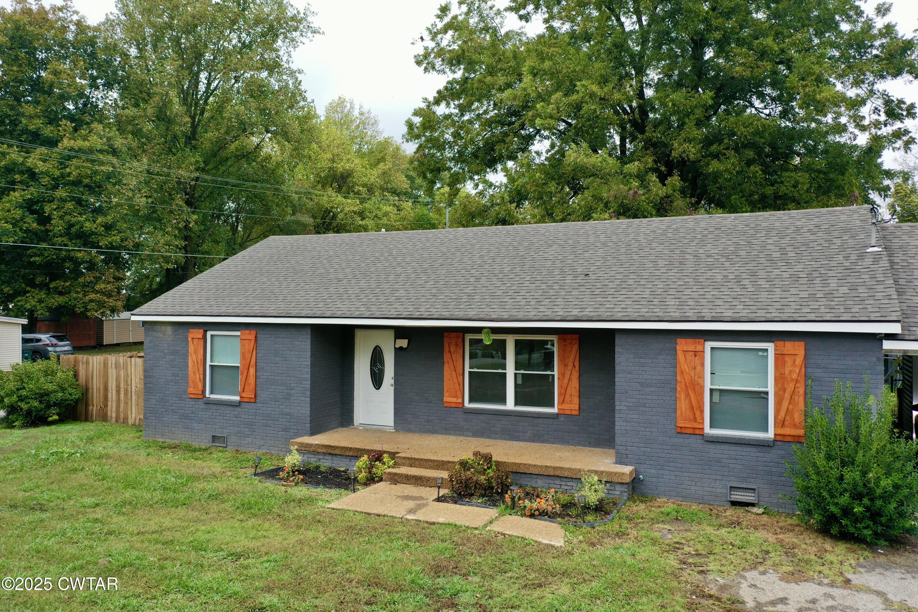 712 West Main Street Newbern, TN 38059 - Photo 21 of 27 a house view with a garden space