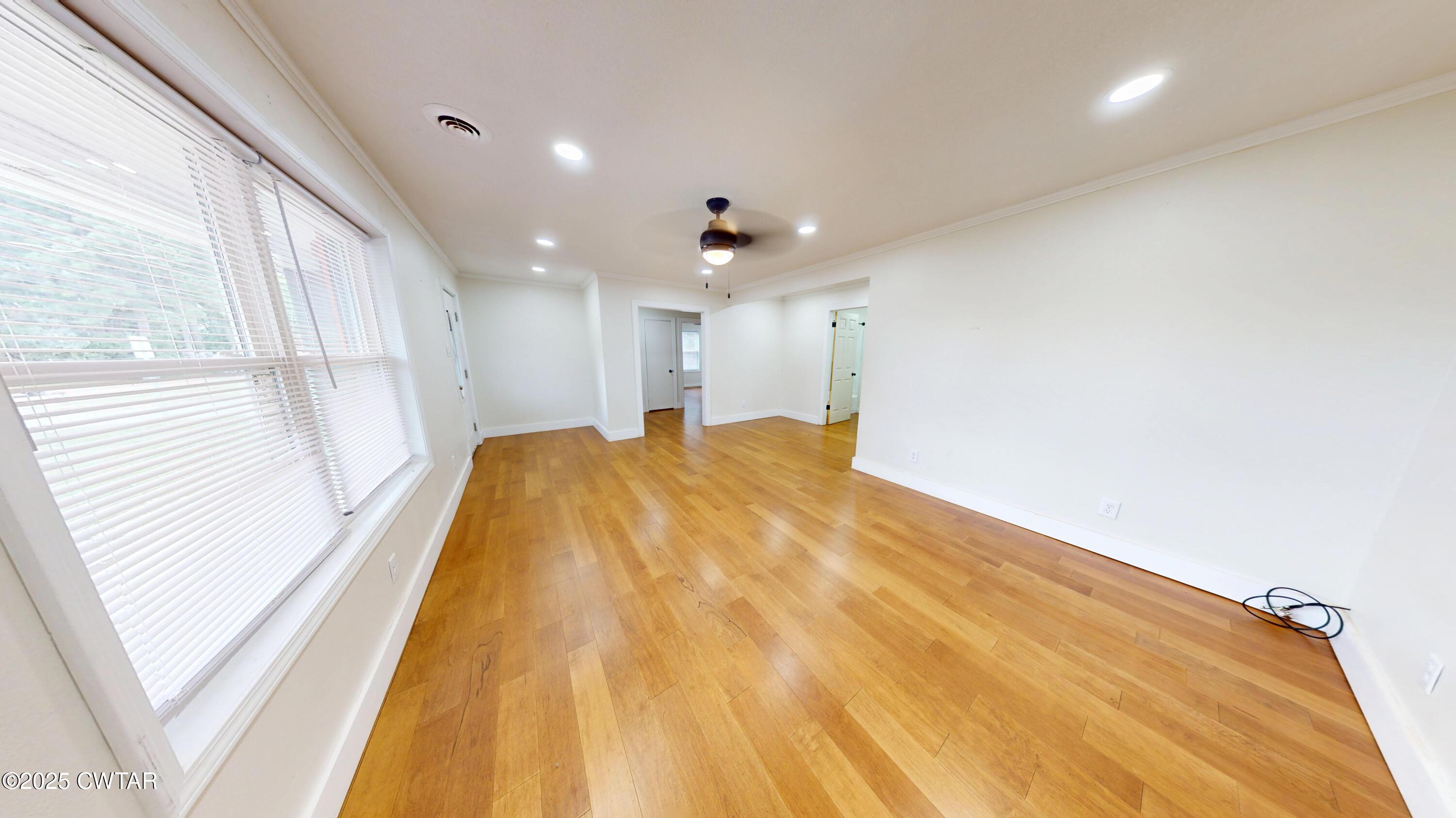 712 West Main Street Newbern, TN 38059 - Photo 3 of 27 a large white room with a large window