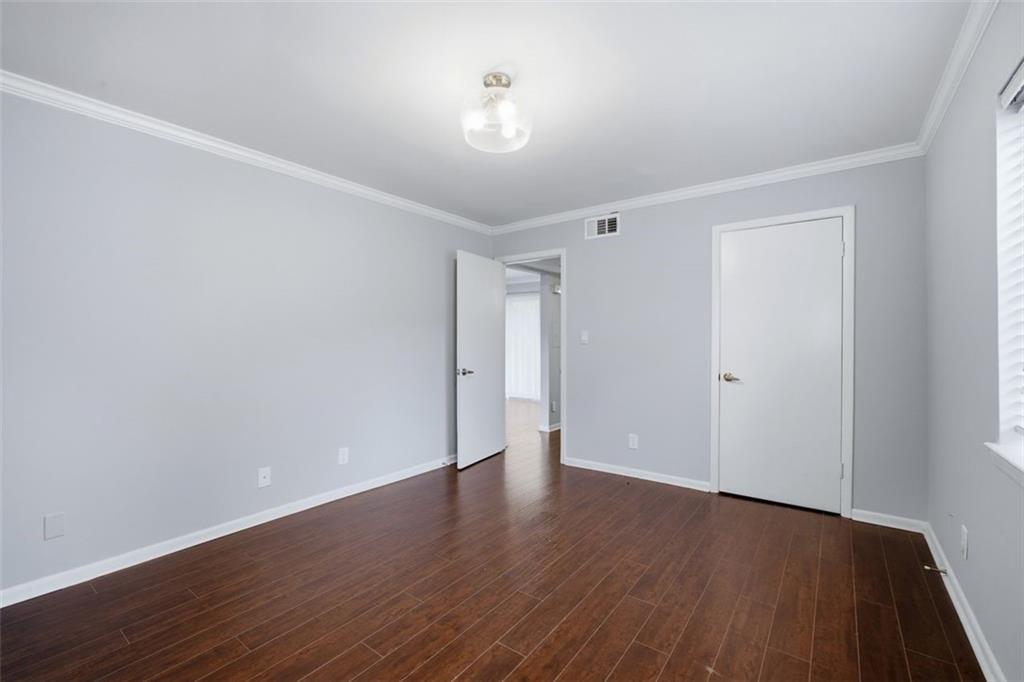 4266 Roswell Road Northeast, Unit E4 Atlanta, GA 30342 - Photo 14 of 24 a view of an empty room with wooden floor