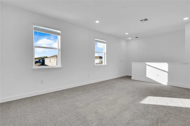 a kitchen with stainless steel appliances granite countertop a refrigerator and a stove