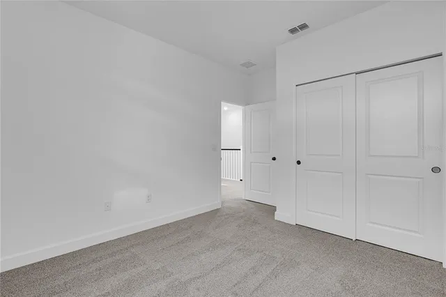 a view of a hallway with staircase