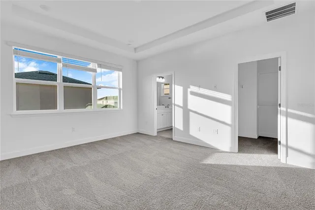 a room with a sink vanity and mirror