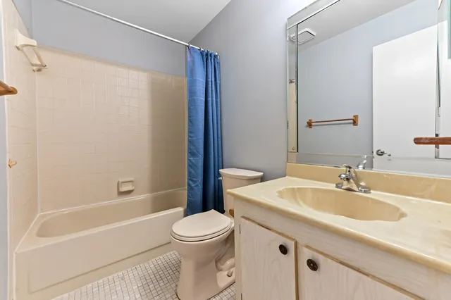 a bathroom with a sink a toilet and a bathtub