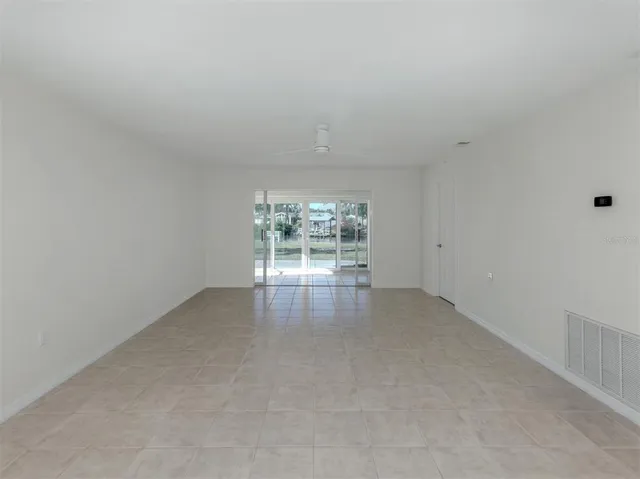 a room with sliding glass door and glass door