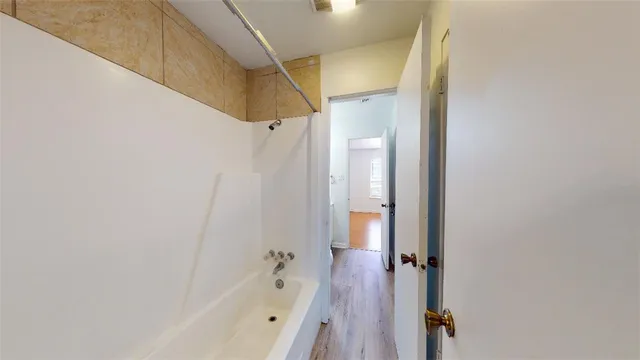 a view of bathroom with a toilet sink and mirror