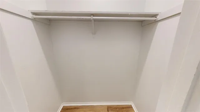 a view of balcony with wooden floor