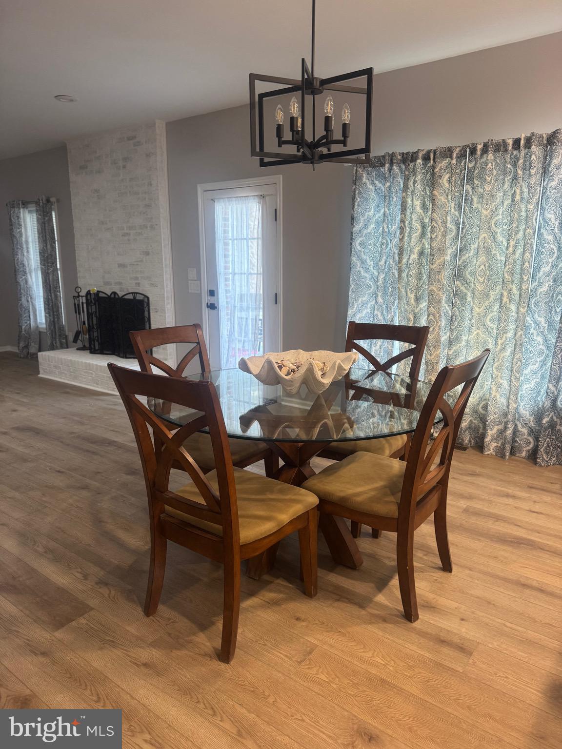10342 Friendship Road Berlin, MD 21811 - Photo 12 of 35 a view of a dining room with furniture and wooden floor