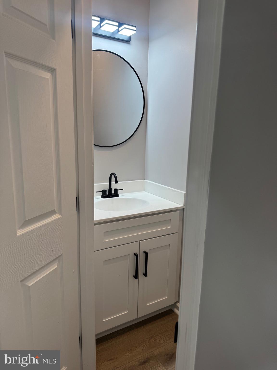 10342 Friendship Road Berlin, MD 21811 - Photo 17 of 35 a bathroom with a sink and a mirror