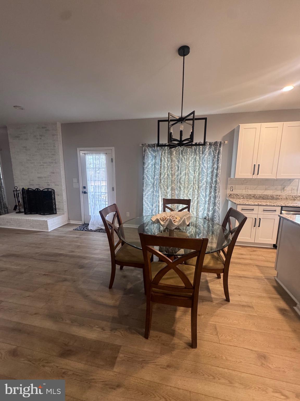 10342 Friendship Road Berlin, MD 21811 - Photo 18 of 28 a view of a dining room with furniture window and wooden floor