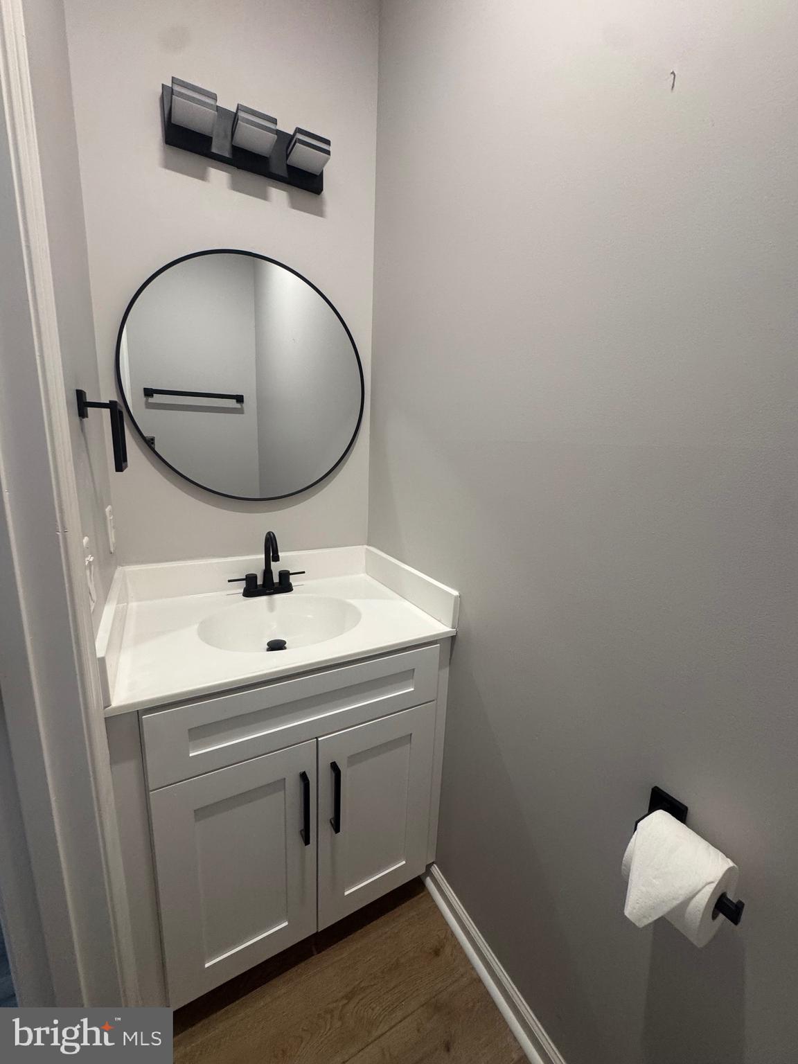 10342 Friendship Road Berlin, MD 21811 - Photo 19 of 28 a bathroom with a sink and mirror