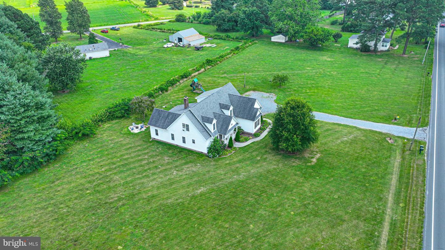 10342 Friendship Road Berlin, MD 21811 - Photo 2 of 35 a green field with some trees in the background