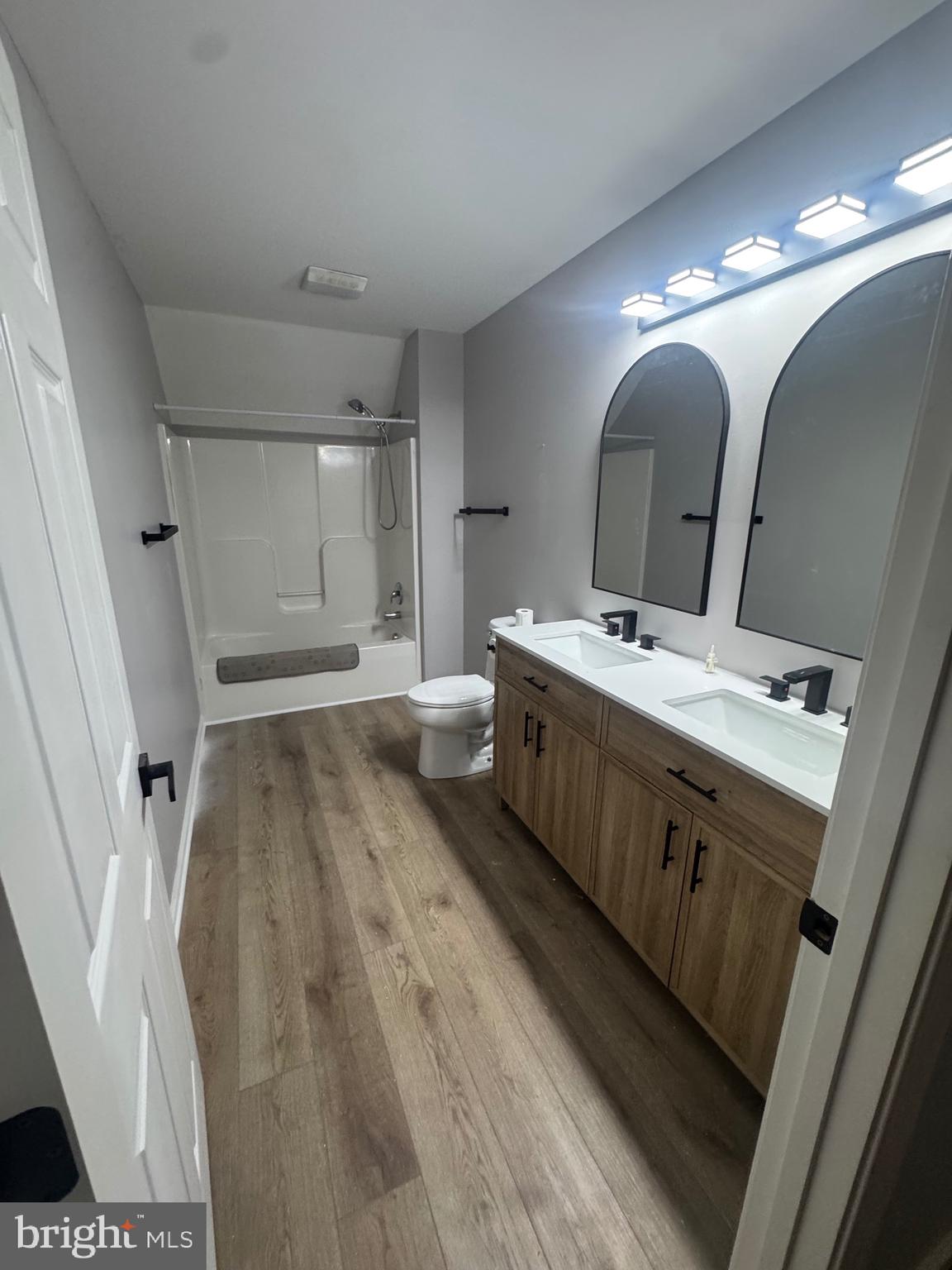 10342 Friendship Road Berlin, MD 21811 - Photo 24 of 35 a spacious bathroom with a double vanity sink and a mirror
