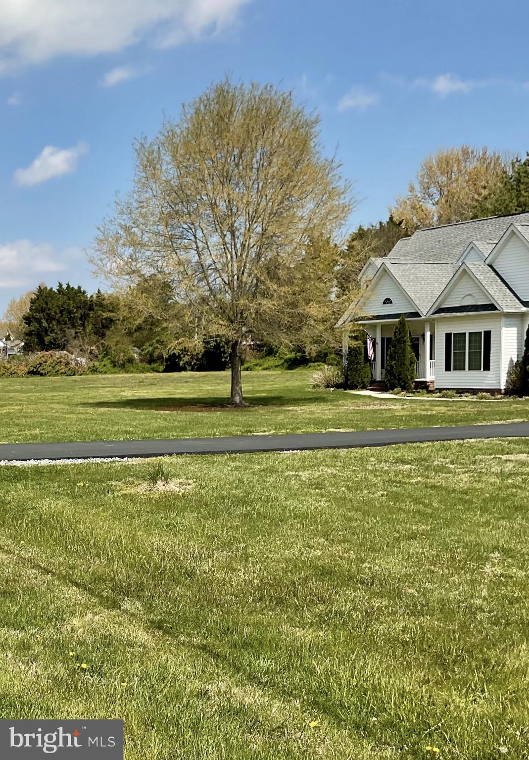10342 Friendship Road Berlin, MD 21811 - Photo 27 of 35 a front view of a house with a garden