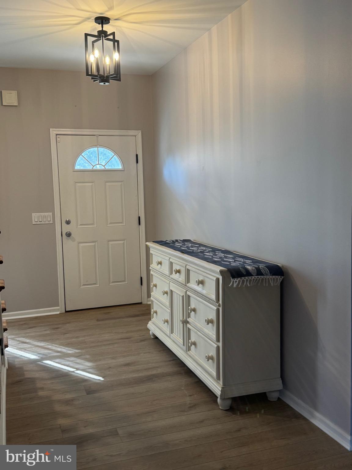 10342 Friendship Road Berlin, MD 21811 - Photo 28 of 28 a kitchen with cabinets and wooden floor