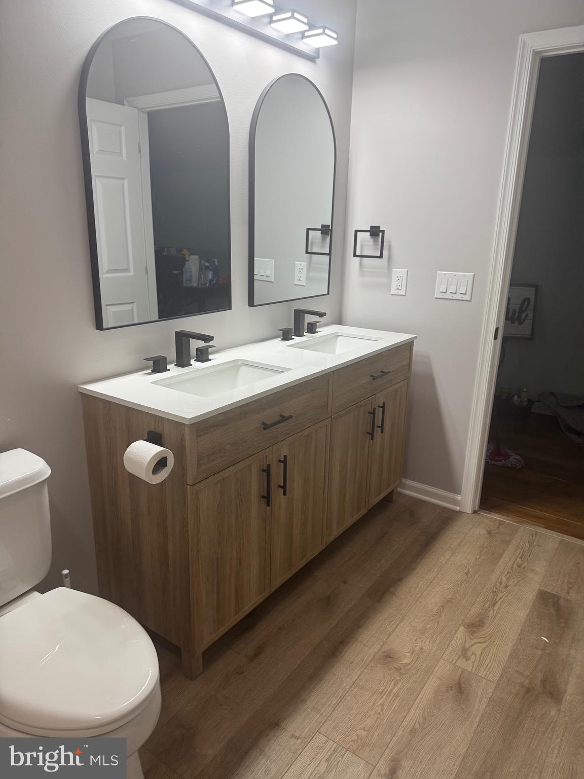 10342 Friendship Road Berlin, MD 21811 - Photo 31 of 35 a bathroom with a toilet sink and mirror