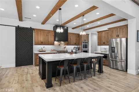 a kitchen with appliances cabinets and a counter top space
