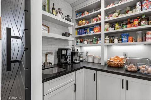 a bathroom with a shower and a stove top oven