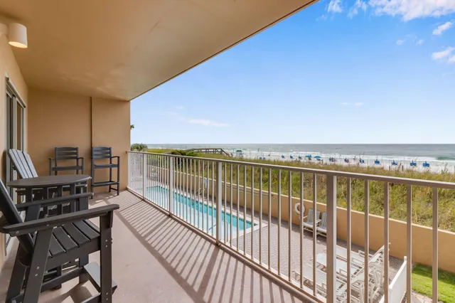 a view of balcony with wooden floor