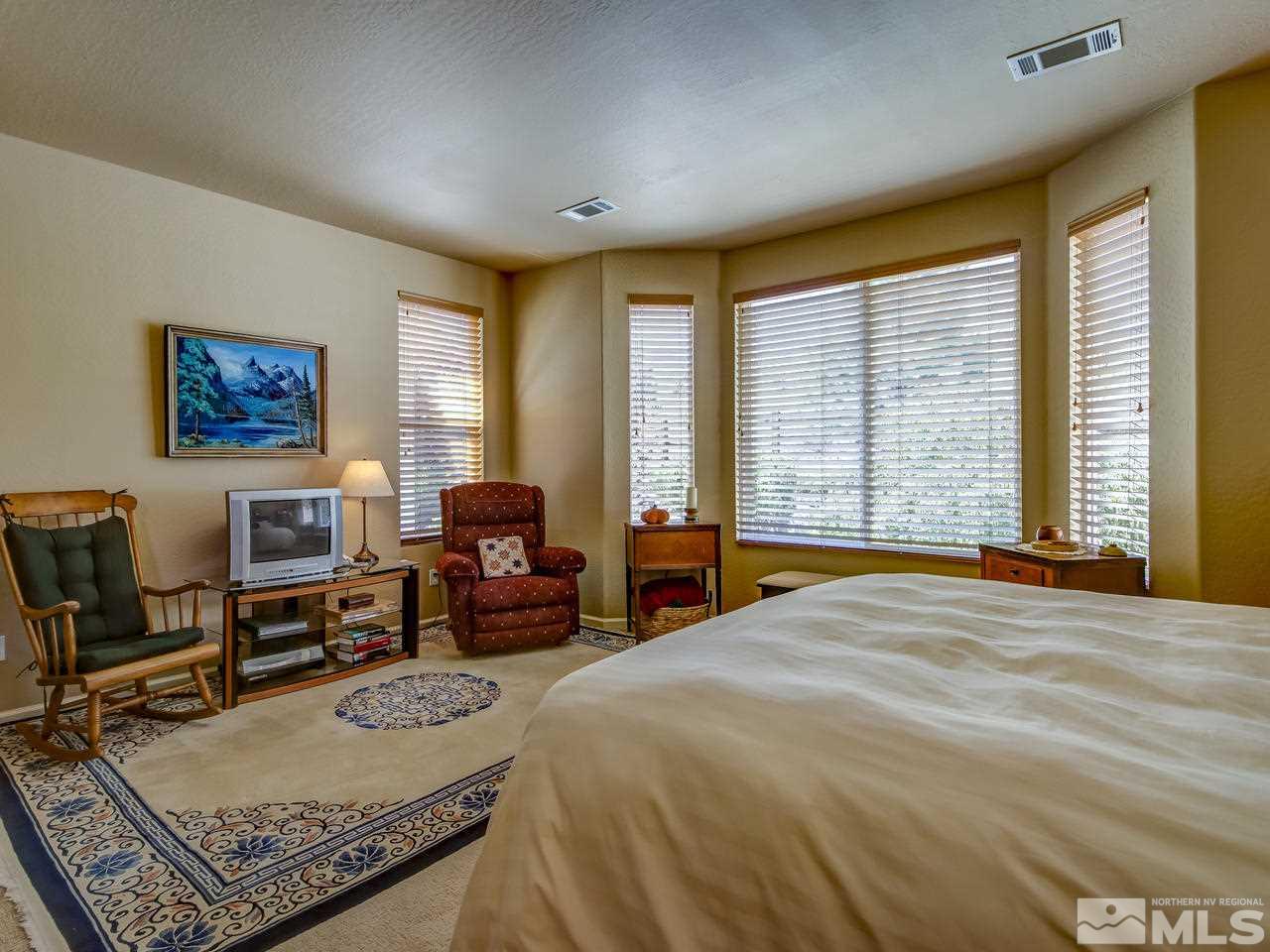 1100 Meridian Ranch Drive Reno, NV 89523 - Photo 16 of 25 a bed room with furniture and a window