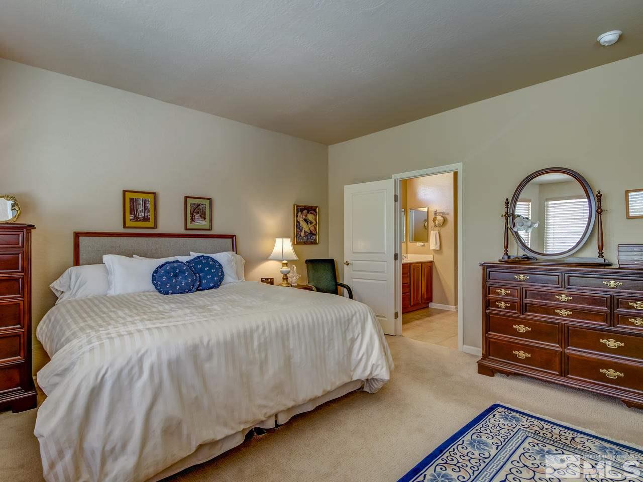 1100 Meridian Ranch Drive Reno, NV 89523 - Photo 17 of 25 a bedroom with a bed and a dresser