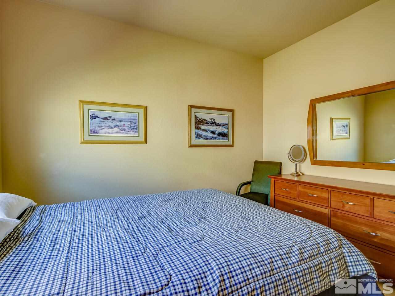 1100 Meridian Ranch Drive Reno, NV 89523 - Photo 20 of 25 a bedroom with bed and wall painting