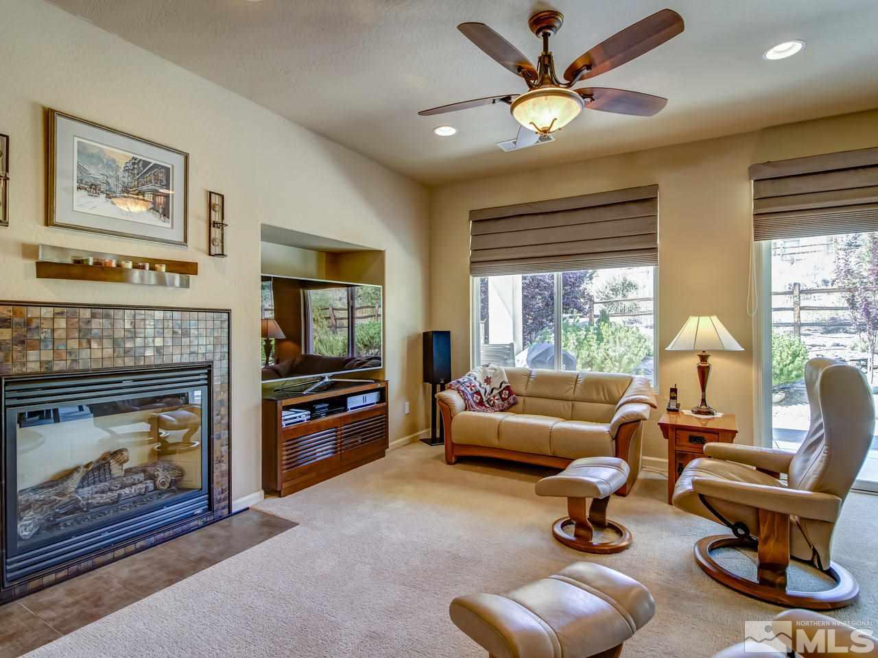 1100 Meridian Ranch Drive Reno, NV 89523 - Photo 4 of 25 a living room with furniture and a fireplace