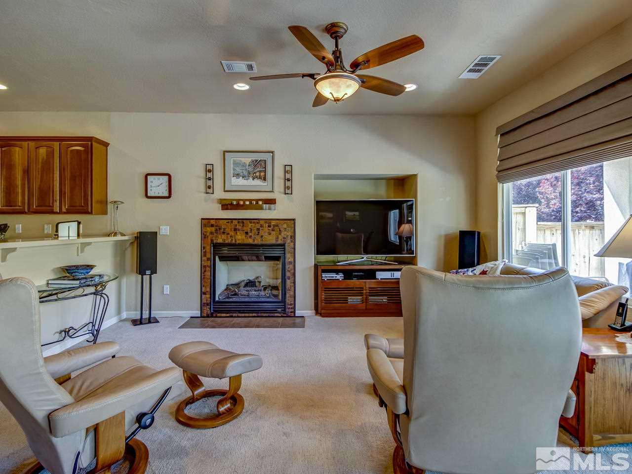 1100 Meridian Ranch Drive Reno, NV 89523 - Photo 6 of 25 a living room with furniture and a flat screen tv
