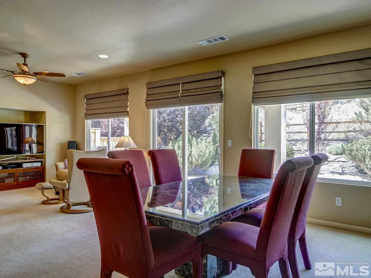 1100 Meridian Ranch Drive Reno, NV 89523 - Photo 9 of 25 a view of a dining room with furniture window and outside view