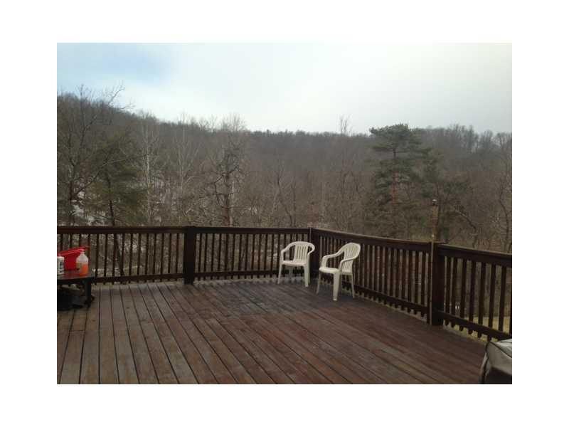 413 Ww Railroad Road Sycamore, PA 15364 - Photo 8 of 10 Patio/Deck. Large side deck with gorgeous view ~ wooded area surrounding home with babbling creek too