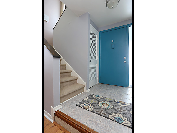 737 Shepard Court Gurnee, IL 60031 - Photo 2 of 18 a view of a room with a floor to ceiling window and stairs