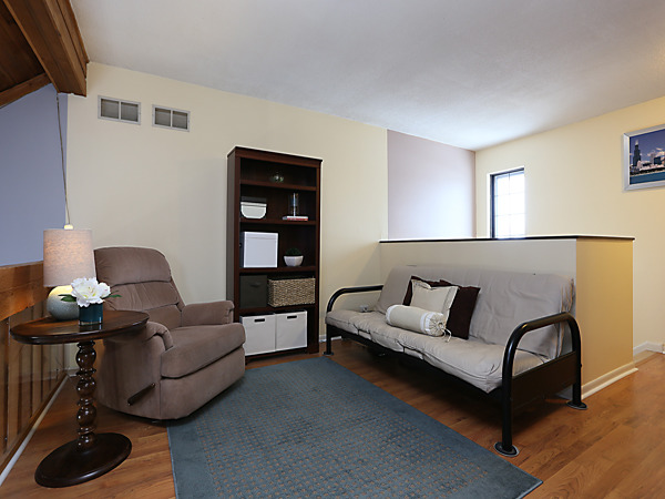 737 Shepard Court Gurnee, IL 60031 - Photo 18 of 18 a living room with furniture and wooden floor