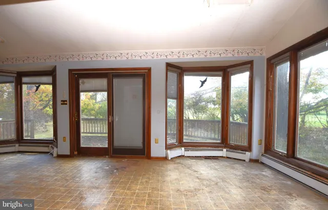 a kitchen with a refrigerator a stove a sink and a window