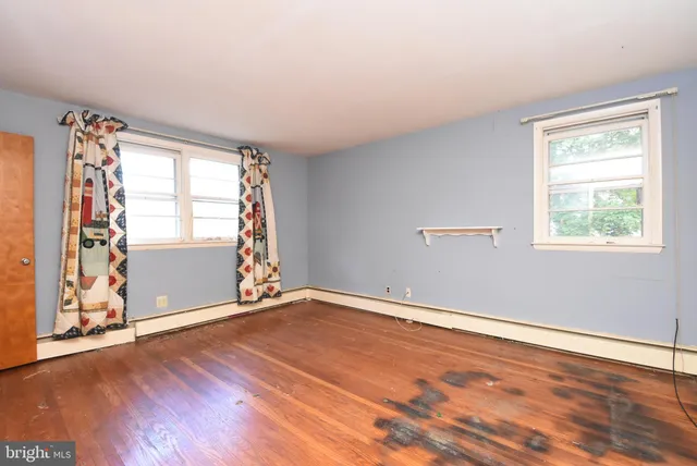 a view of empty room with windows