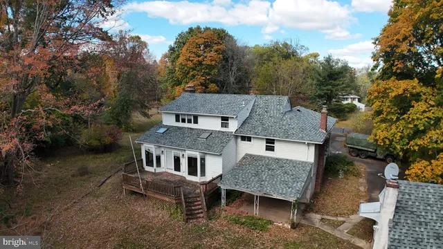 a front view of a house with a yard and balcony