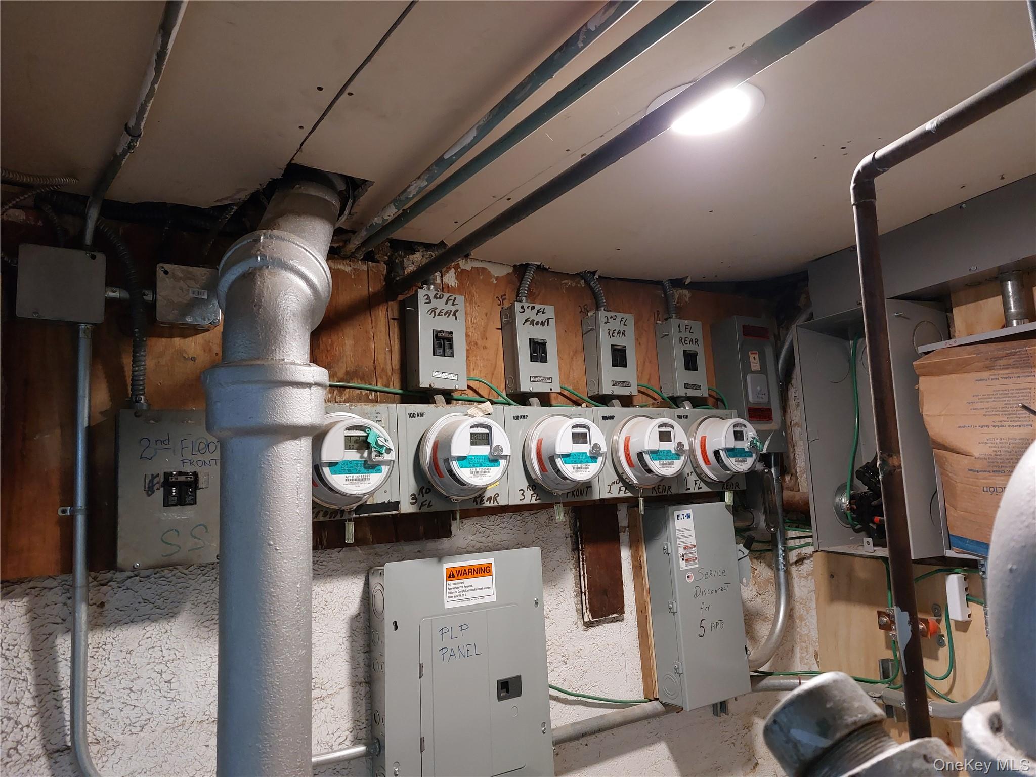 52-12 108th Street Queens, NY 11368 - Photo 6 of 8 a utility room with dryer and washer