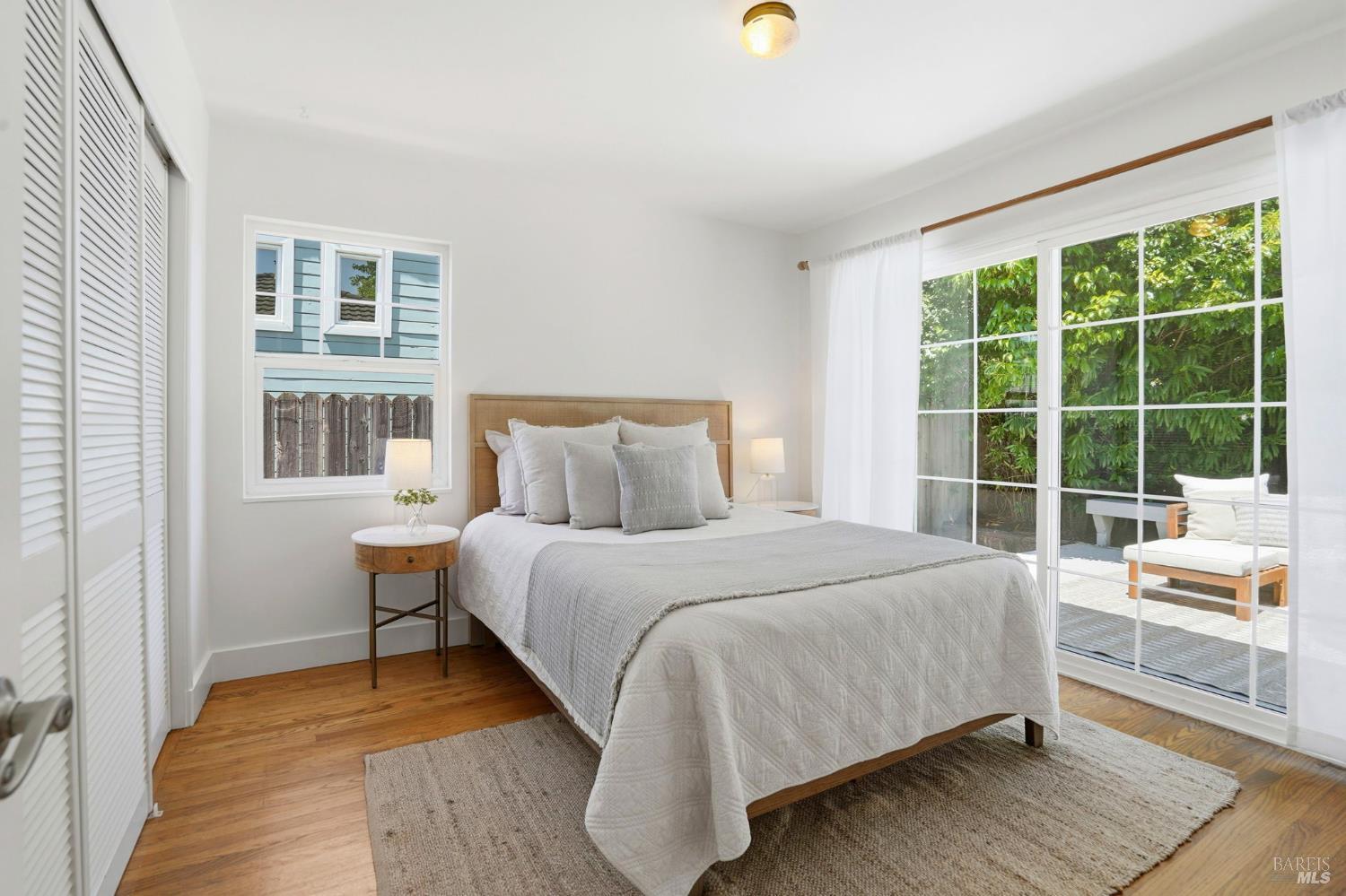 234 Solano Street San Rafael, CA 94901 - Photo 8 of 24 a bedroom with a bed and a large window with outer view