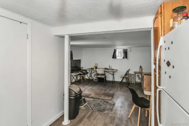 a view of living room with furniture and a chandelier