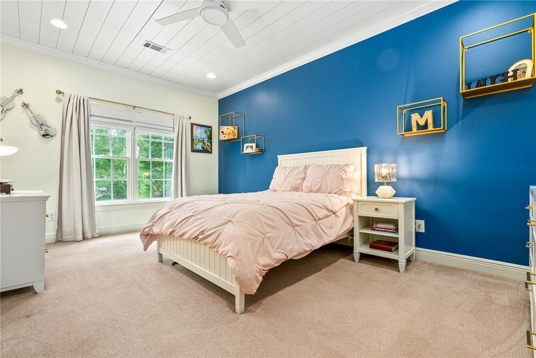 1657 Abby Road Auburn, AL 36830 - Photo 30 of 39 This inviting bedroom features a cozy bed and ample natural light from large windows.