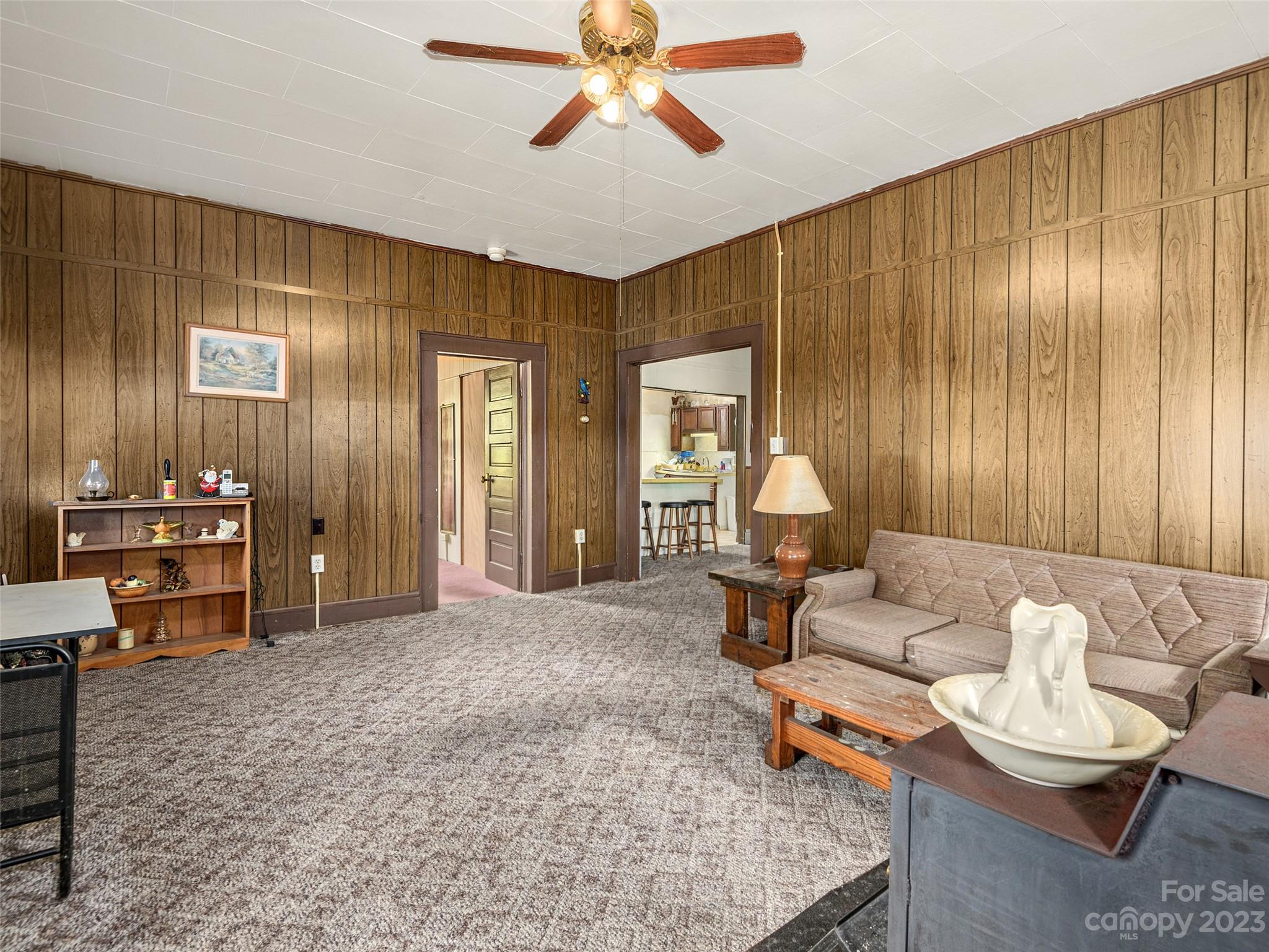 118 North Canton Road Canton, NC 28716 - Photo 5 of 17 a living room with furniture and a chandelier