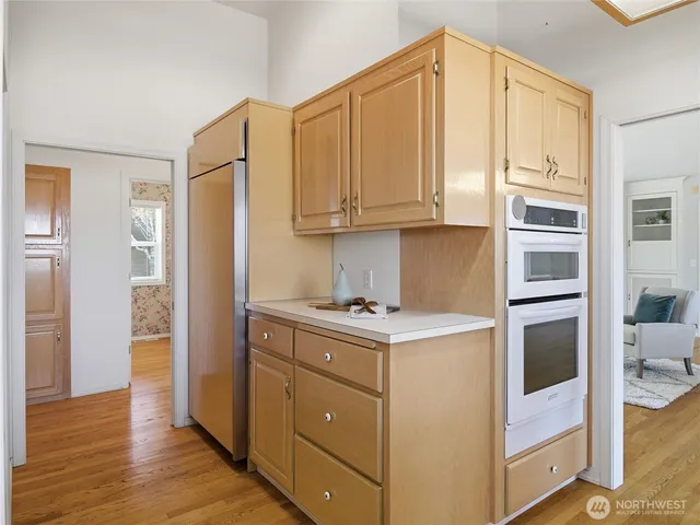 a kitchen with stainless steel appliances granite countertop a stove and a refrigerator