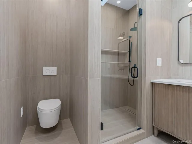 a bathroom with a shower and toilet