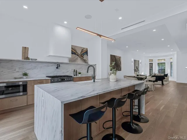 a kitchen with a stove a sink and a refrigerator